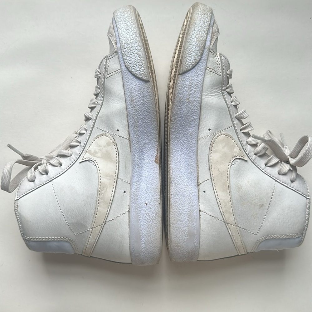 Cream colored Nike blazers size 4Y with Lavender sole and heal details